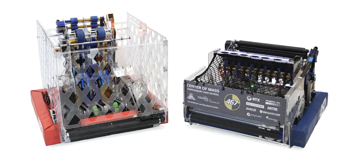 Team 467’s two 2026 robots side by side: V1 with clear diamond-cut panels and red bumpers, and V2 with dark sponsor panels and blue bumpers